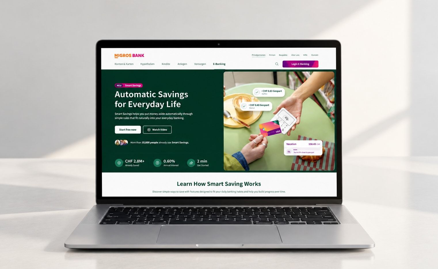 Laptop showing the Migros Bank website with the “Automatic Savings for Everyday Life” campaign